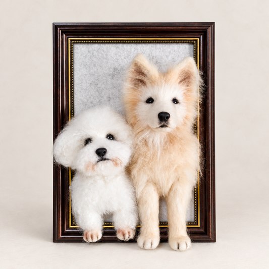 Framed wool-felt portrait of two dogs sitting side by side, front view